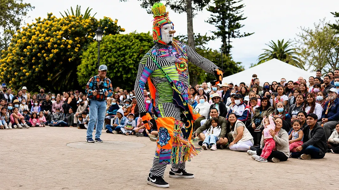 Colorful street performer entertaining crowd at Tenerife festival event